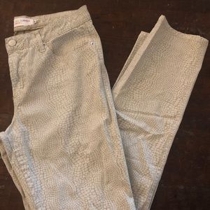 Snakeskin skinny jeans.